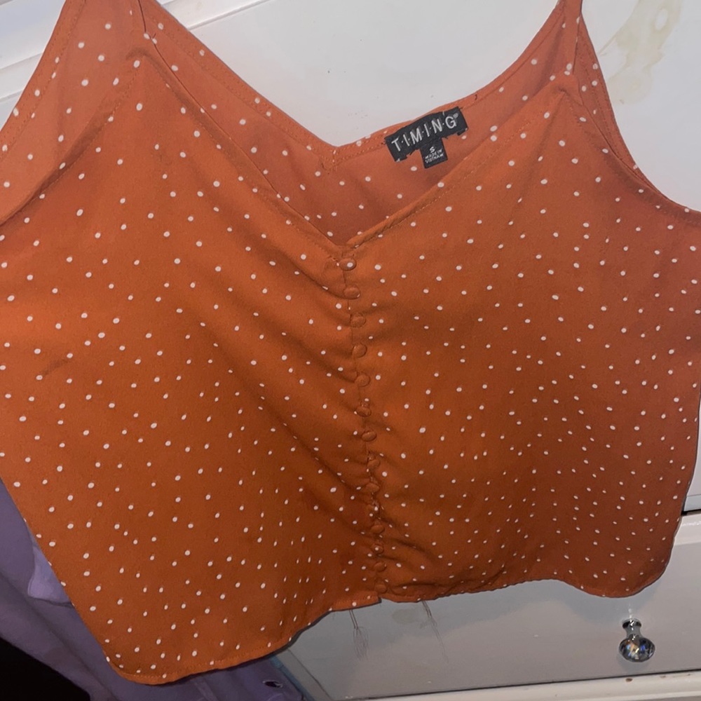 Orange spaghetti blouse. Small but fits up to medium